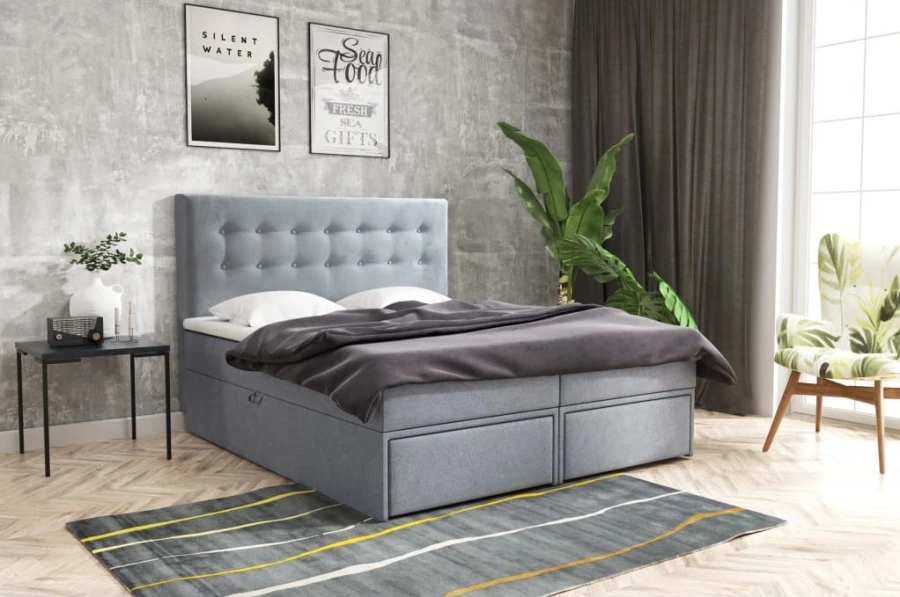 Hellblaues Polsterbett mit Stauraumschubladen und gestepptem Design.
