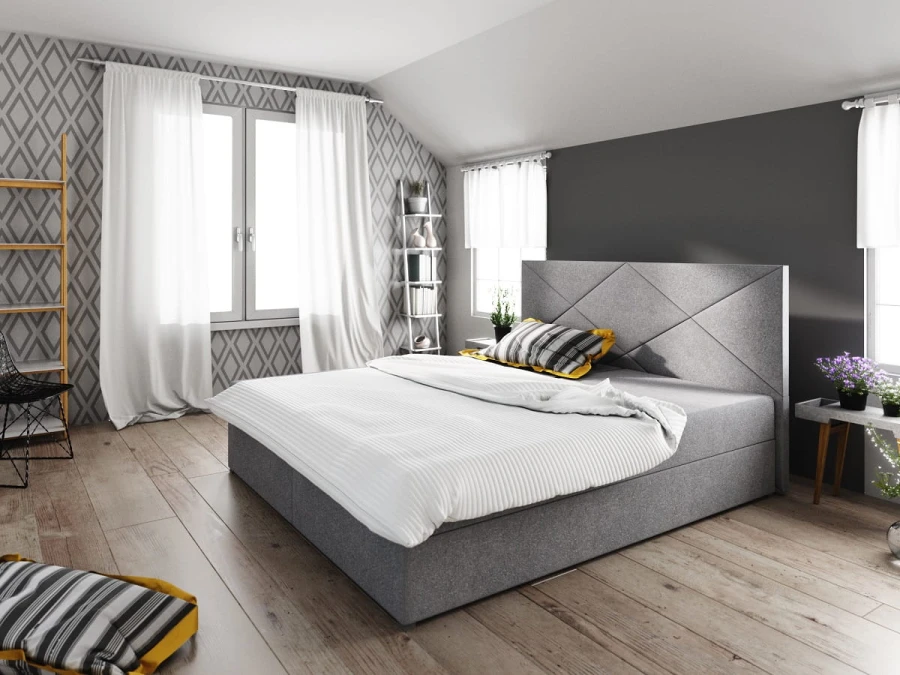 Hellgraues Boxspringbett mit weißer Bettwäsche und Rautenmuster am Kopfteil.