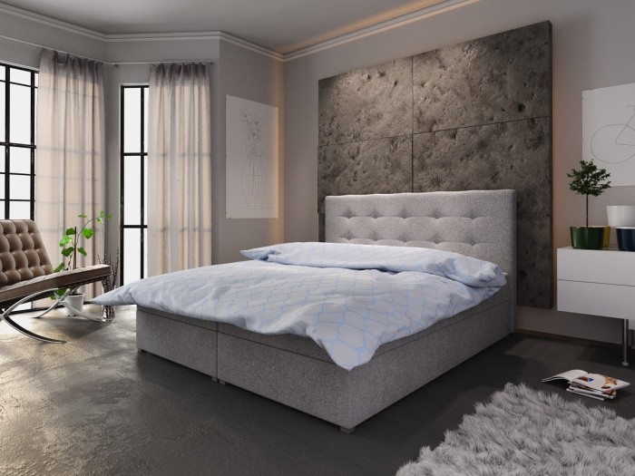 Hellgraues Boxspringbett mit gestepptem Kopfteil in modernem Design für das Schlafzimmer.