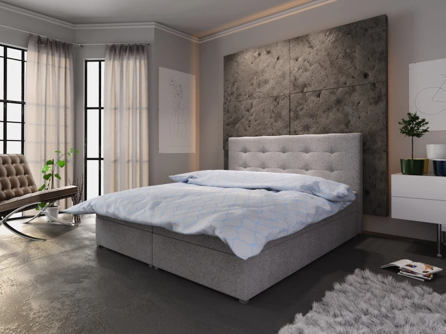 Hellgraues Boxspringbett mit gestepptem Kopfteil in modernem Design für das Schlafzimmer.