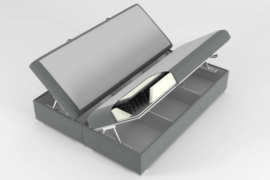 Modernes Boxspringbett in Grau mit praktischem Bettkasten und Matratzen-Detail.