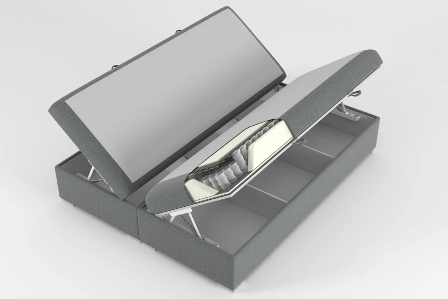 Graues Boxspringbett mit zwei Bettkästen und Matratzen-Querschnitt