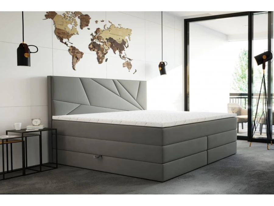 Graues Polsterbett mit geometrischem Kopfteil und Matratze im modernen Schlafzimmer.