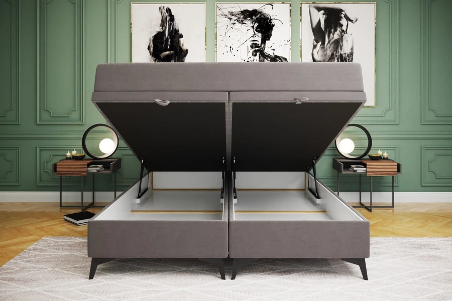 Geöffnetes Doppelbett in Grau mit viel Stauraum durch zwei Bettkästen.