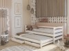 Weißes Kinderbett mit ausziehbarem Gästebett und Schubladen in modernem Kinderzimmer-Ambiente.