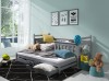 Graues Kinder-Funktionsbett aus Holz in einem hellblauen Zimmer.