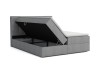 Graues Boxspringbett mit aufklappbarem Bettkasten und Stauraum für Bettwäsche.