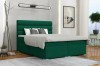 Dunkelgrünes Boxspringbett mit gestepptem Kopfteil in einem modern eingerichteten Zimmer.