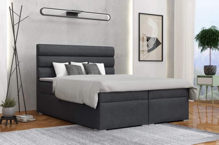 Modernes Boxspringbett in Anthrazit mit gestepptem Kopfteil im stilvollen Schlafzimmer.