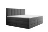 Modernes dunkelgraues Boxspringbett mit hohem gepolstertem Kopfteil und weißer Matratze.