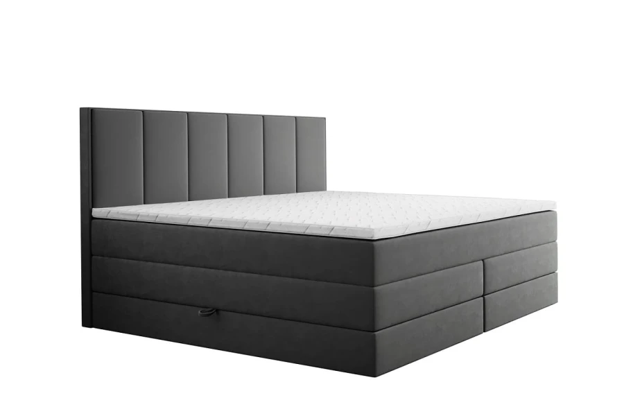 Modernes dunkelgraues Boxspringbett mit hohem gepolstertem Kopfteil und weißer Matratze.