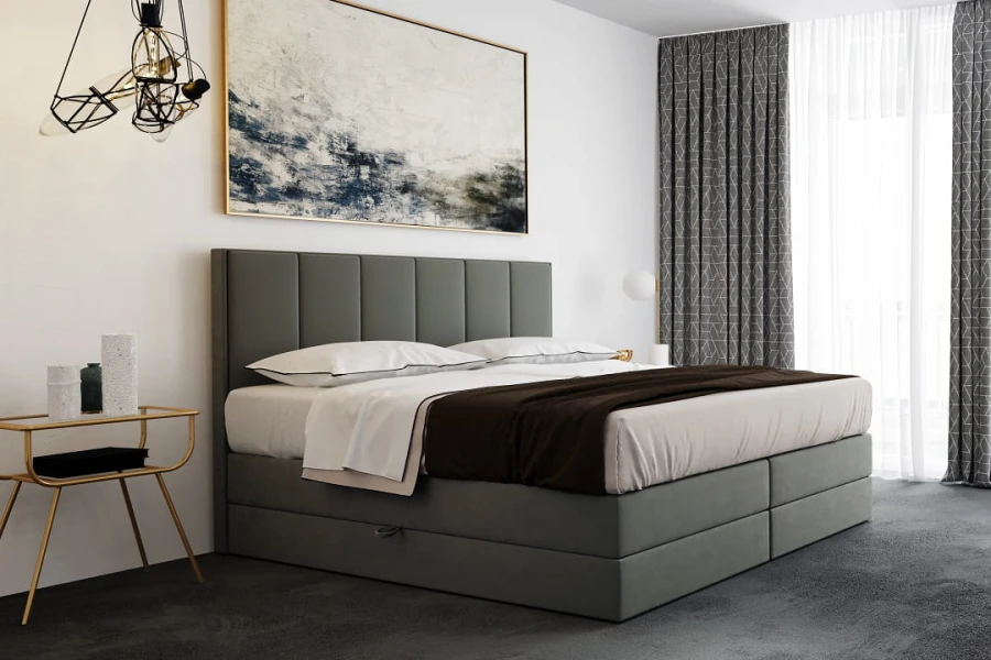 Gepolstertes Boxspringbett in Grau im modernen Schlafzimmer-Design.