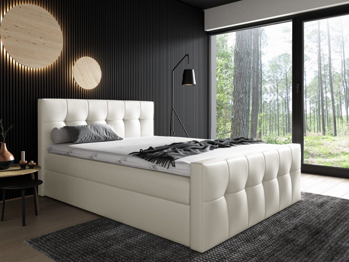 Modernes cremefarbenes Polsterbett mit quadratischer Steppung im Schlafzimmer.