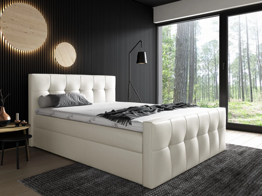 Modernes cremefarbenes Polsterbett mit quadratischer Steppung im Schlafzimmer.