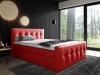 Auffälliges rotes Polsterbett mit gestepptem Design vor einer dunklen Wand.