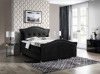 Luxuriöses schwarzes Polsterbett aus Samt mit eleganter Steppung und Design-Füßen.