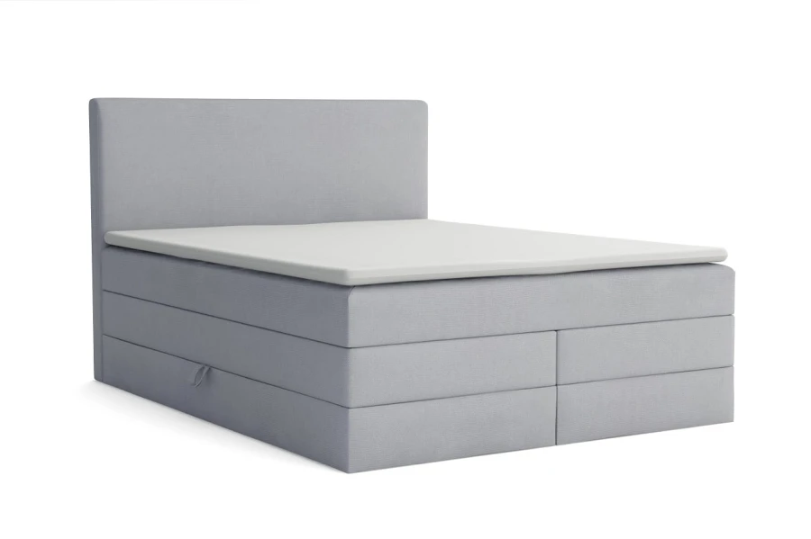 Modernes hellgraues Boxspringbett mit Stauraumfunktion und schlichtem Kopfteil auf weißem Hintergrund.