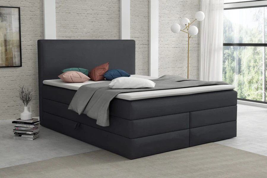 Modernes Boxspringbett in Anthrazit mit gepolstertem Kopfteil für ein stilvolles Schlafzimmer.
