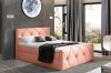 Stilvolles Boxspringbett in Lachsfarben mit dekorativer Rautensteppung und gemütlichem Flair.