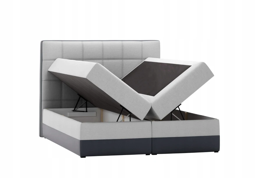 Graues Boxspringbett mit zwei aufgeklappten Bettkästen für viel Stauraum, isoliert auf Weiß.