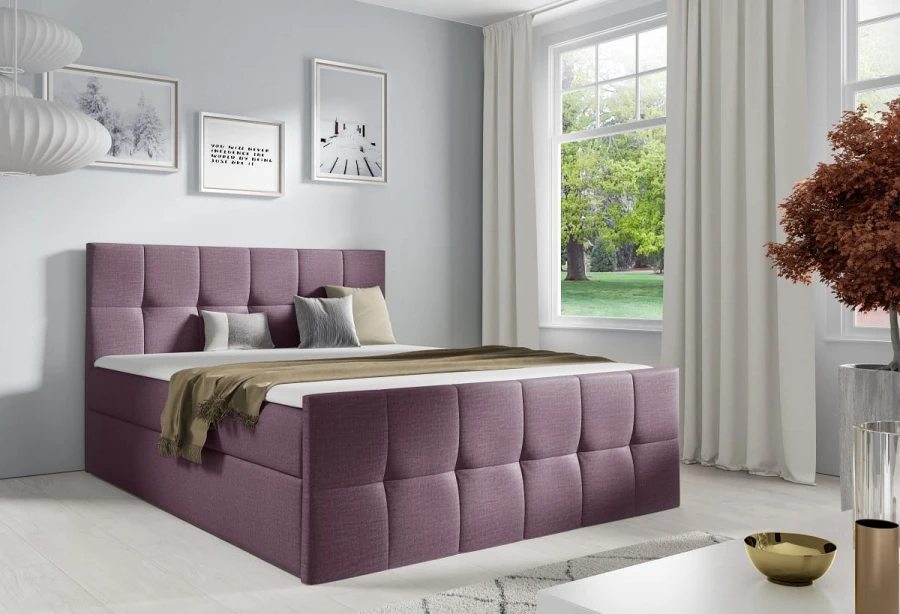 Violettes Boxspringbett mit quadratischer Steppung und gemütlichen Kissen.