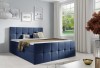 Dunkelblaues Boxspringbett in zeitlosem Design für modernes Wohnen.