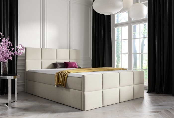Elegantes beige Boxspringbett mit quadratisch gestepptem Kopfteil und Fußteil.