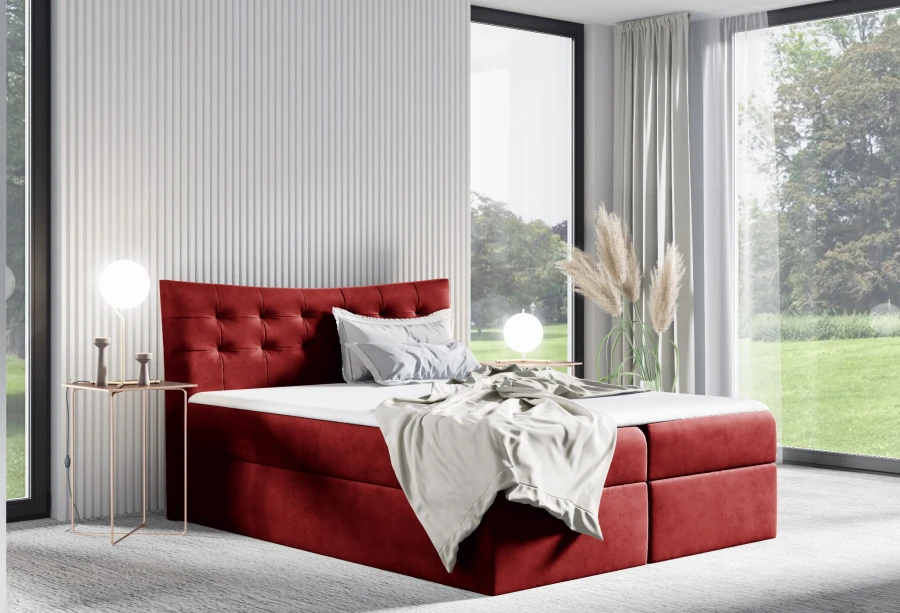 Rotes Boxspringbett mit gestepptem Kopfteil aus Samt in modernem Schlafzimmer.