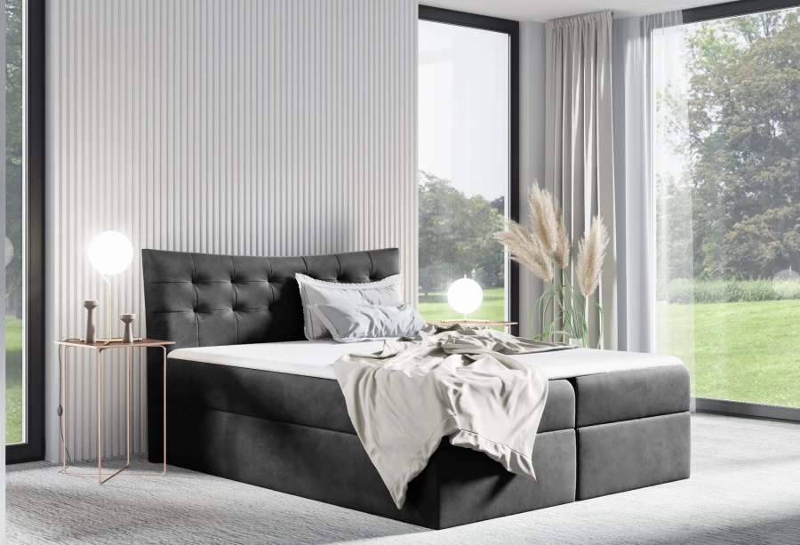 Anthrazitfarbenes Boxspringbett mit gestepptem Samt-Kopfteil und weißer Decke.