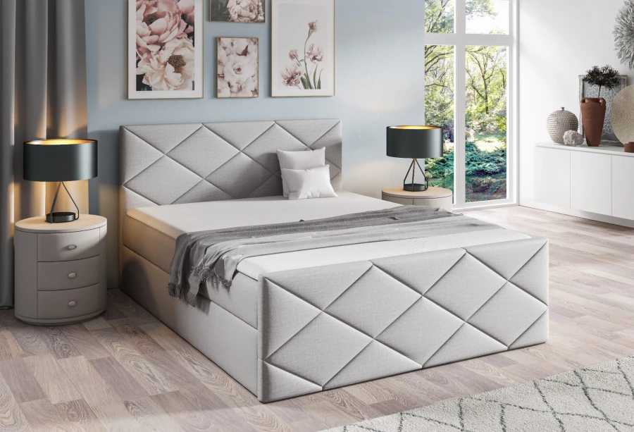 Stilvolles Boxspringbett in Hellgrau mit hochwertiger Rautensteppung.