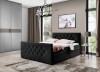 Schwarzes Boxspringbett mit Samtbezug und Kristallknöpfen in moderner Schlafzimmerumgebung.