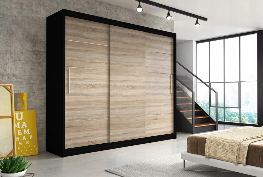 Sliding door wardrobe Sonoma Oak with black carcass in the bedroom