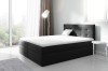 Dunkelgraues Boxspringbett in modernem Design mit weißem Topper und weichem Kopfteil.