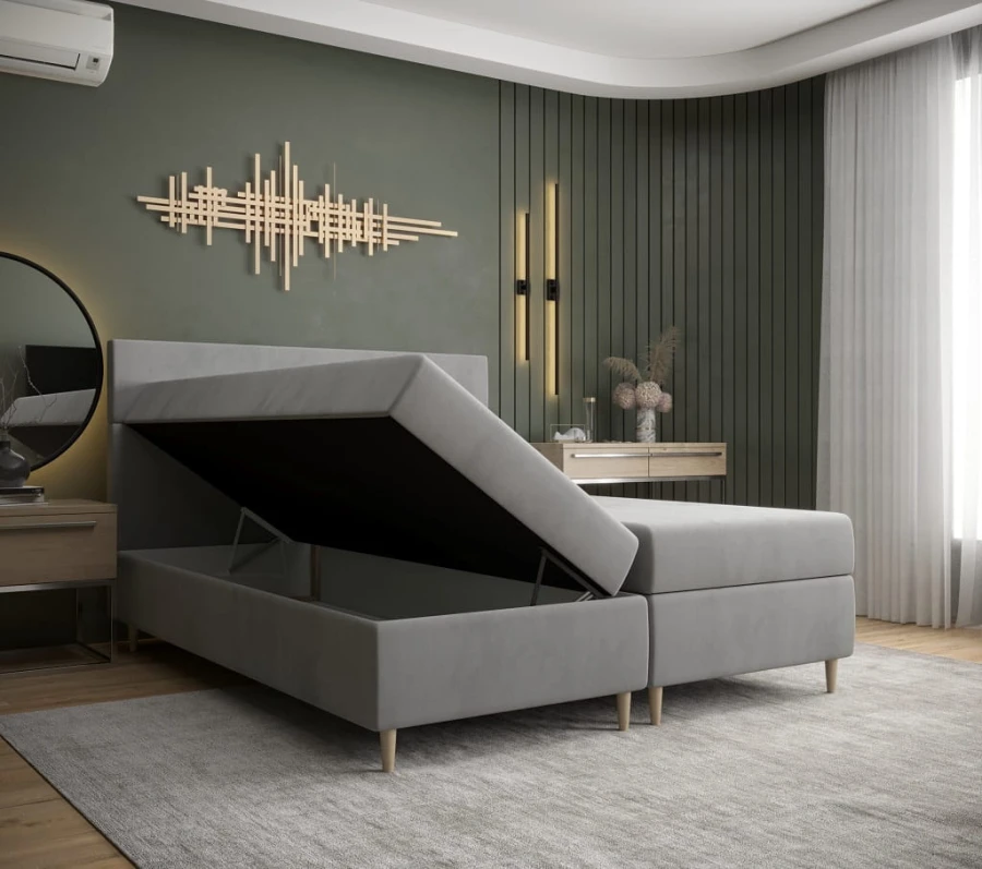 Graues Boxspringbett mit praktischem, offenem Bettkasten für Stauraum