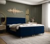 Stilvolles dunkelblaues Boxspringbett für ein modernes Schlafzimmer-Design