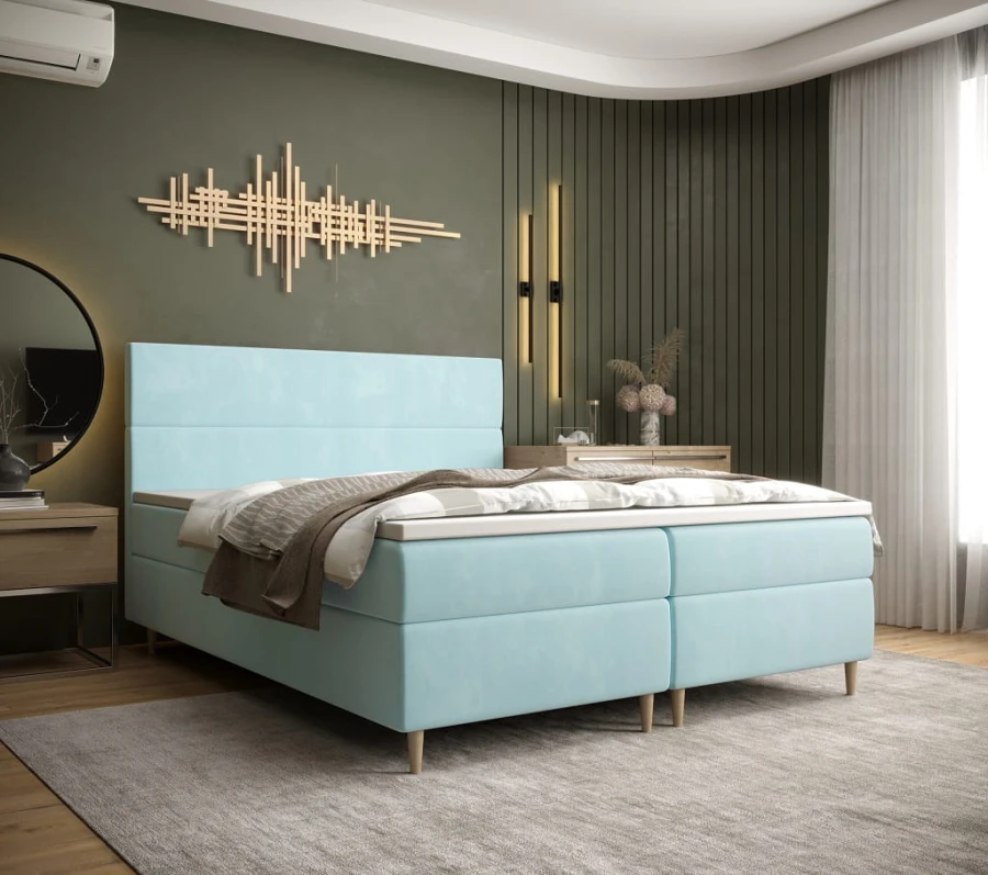 Hellblaues Boxspringbett im modernen Schlafzimmer für erholsamen Schlaf