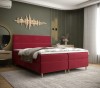 Rotes Boxspringbett in stilvollem Schlafzimmer mit moderner Wanddekoration