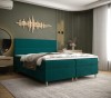 Modernes Boxspringbett in Türkis im stilvoll eingerichteten Schlafzimmer