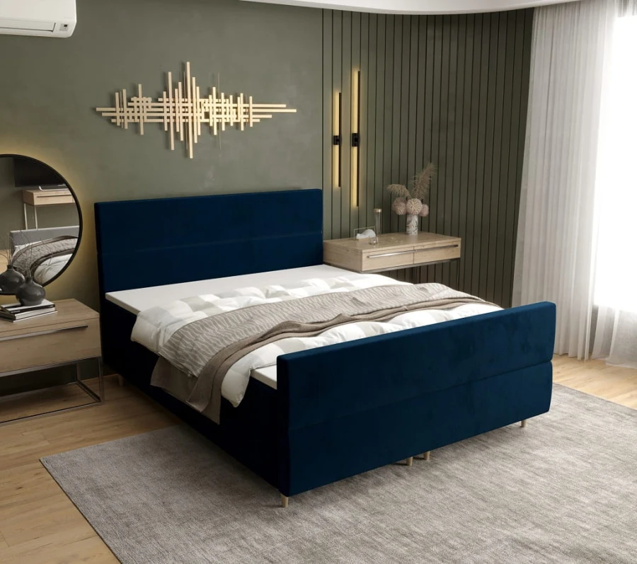 Elegantes Boxspringbett in Dunkelblau passend zu modernem Interieur