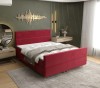 Rotes Boxspringbett mit hohem Kopfteil in modernem Schlafzimmer