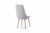 Rear view of a light grey upholstered chair with sturdy legs in wood look.
