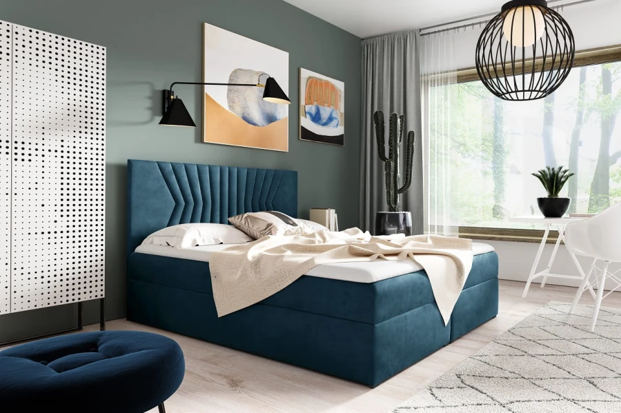 Blaues Boxspringbett aus Samt in modernem Schlafzimmer mit grüner Wandgestaltung.