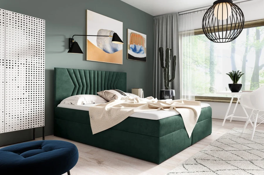 Dunkelgrünes Polsterbett mit gestepptem Kopfteil in stilvollem Schlafzimmer.