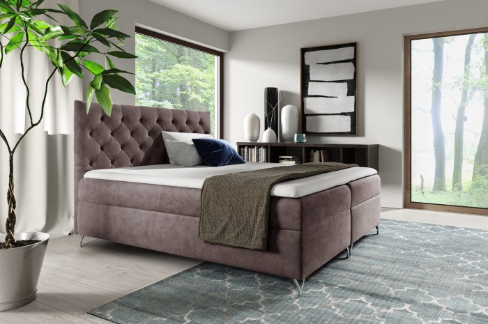 Komfortables Boxspringbett in Taupe mit dekorativer Rautensteppung am hohen Kopfteil.