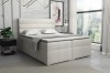 Hellbeiges Boxspringbett für eine freundliche Atmosphäre im Schlafzimmer.