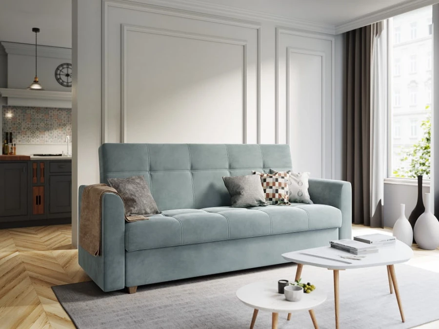 Light blue upholstered sofa with cushions in a modern living room.