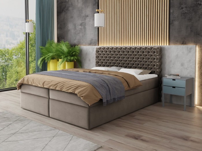 Luxuriöses Boxspringbett in Taupe mit hohem Polsterkopfteil in moderner Einrichtung.