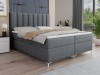 Dunkelgraues Boxspringbett mit stilvollem Kopfteil und gemütlichem Design für modernen Schlafkomfort.