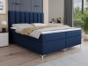 Modernes blaues Boxspringbett mit hohem gepolstertem Kopfteil im stilvollen Schlafzimmer.