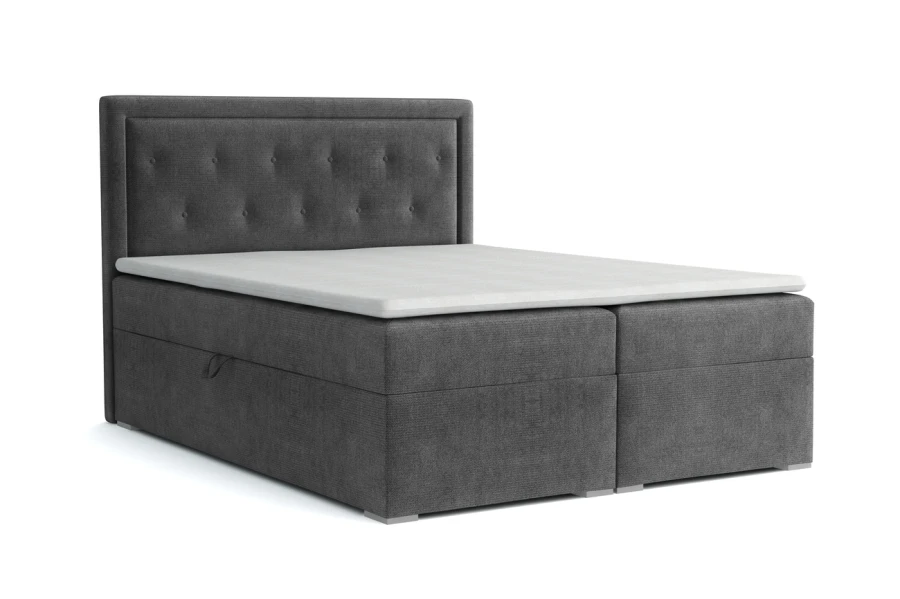 Graues Boxspringbett mit Knopfheftung auf weißem Hintergrund